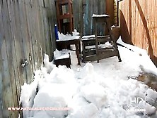Lady Pooping In Her Snow Covered Backyard