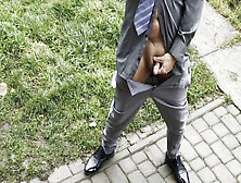 Suited Man In Grey Socks And Tie Spreading Legs